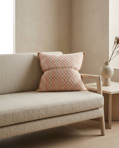 pink bow-shaped knit pillowcase with romb pattern on sofa