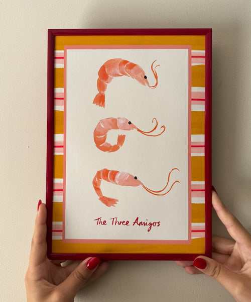 "The Three Amigos" playful art print of three prawns framed by a bold striped border beiing held