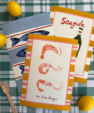 "The Three Amigos" playful art print of three prawns framed by a bold striped border with the collection