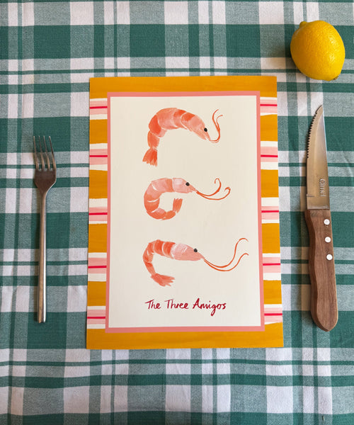 "The Three Amigos" playful art print of three prawns framed by a bold striped border on table
