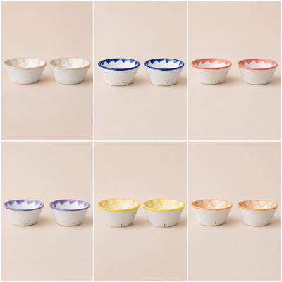 Collage of ceramic bowls with colorful rims on a beige background - lifestyle
