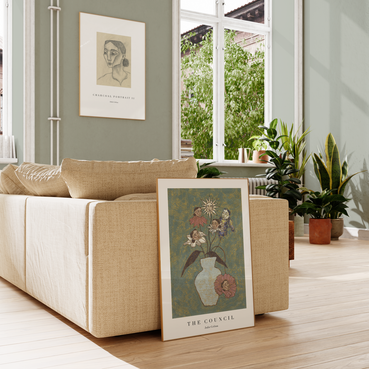 two prints in a livingroom with a sofa and green walls