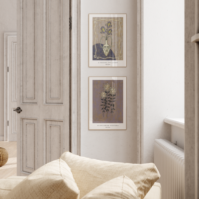 a white room with two purple flower prints on the wall
