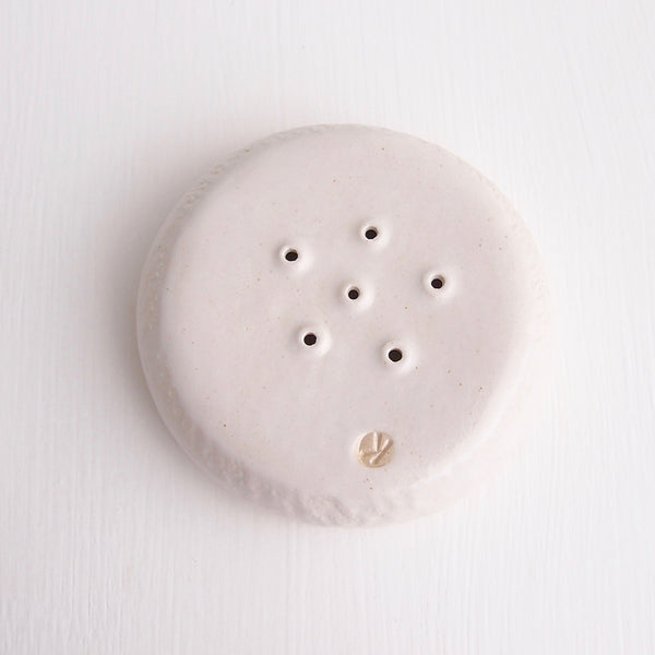 underside white satin pottery soap dish