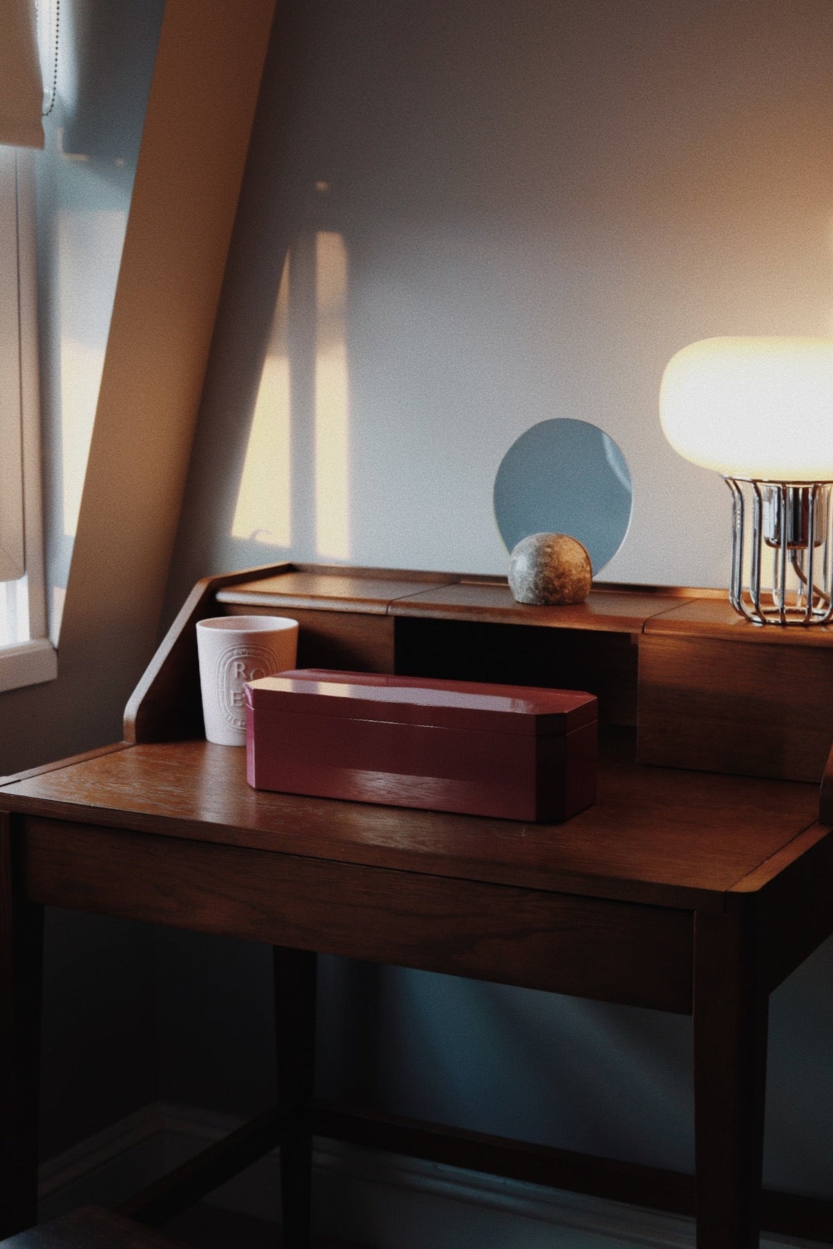 Vinidec octagonal glossy mulberry lacquered jewellery box, styled on a mid-century wooden vanity desk 