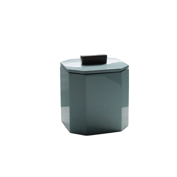 Vinidec geometric powder blue lacquer ice bucket with lid off showing insulated interior on white tablecloth for modern apartment bar cart accessories.