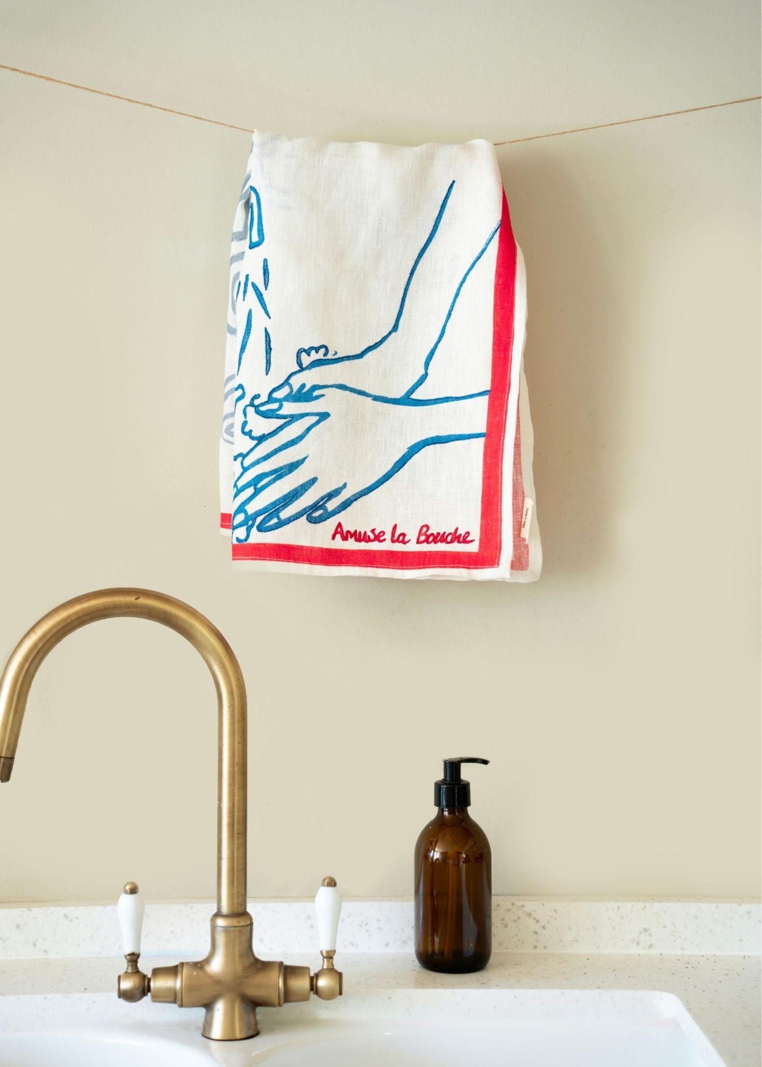 Hanging wash our hands tea towel by Amuse La Bouche