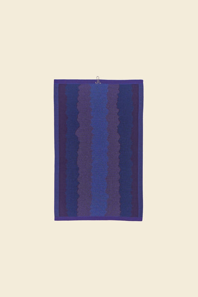 back view of purple knit organic cotton kitchen towel with wavy pattern