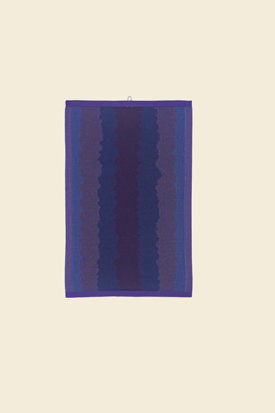 front view of purple knit organic cotton kitchen towel with wavy pattern