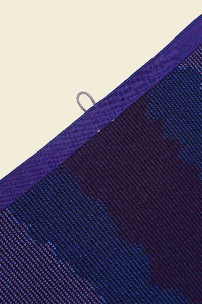 top detail of purple knit organic cotton kitchen towel with wavy pattern