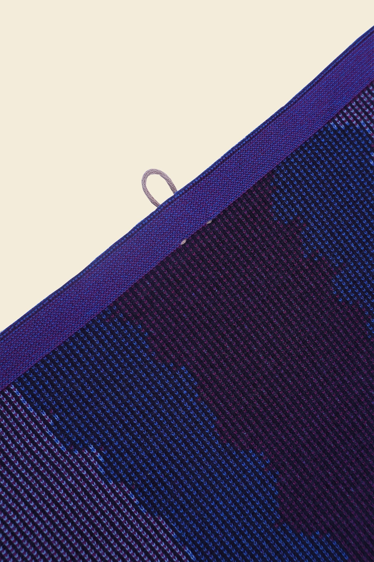 top detail of purple knit organic cotton kitchen towel with wavy pattern