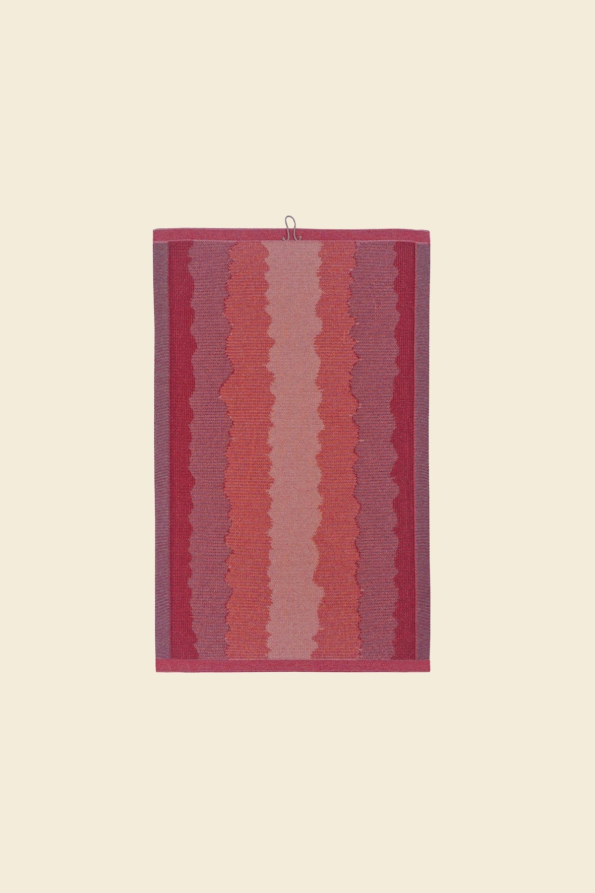 back side of red knit organic cotton kitchen towel with wavy pattern
