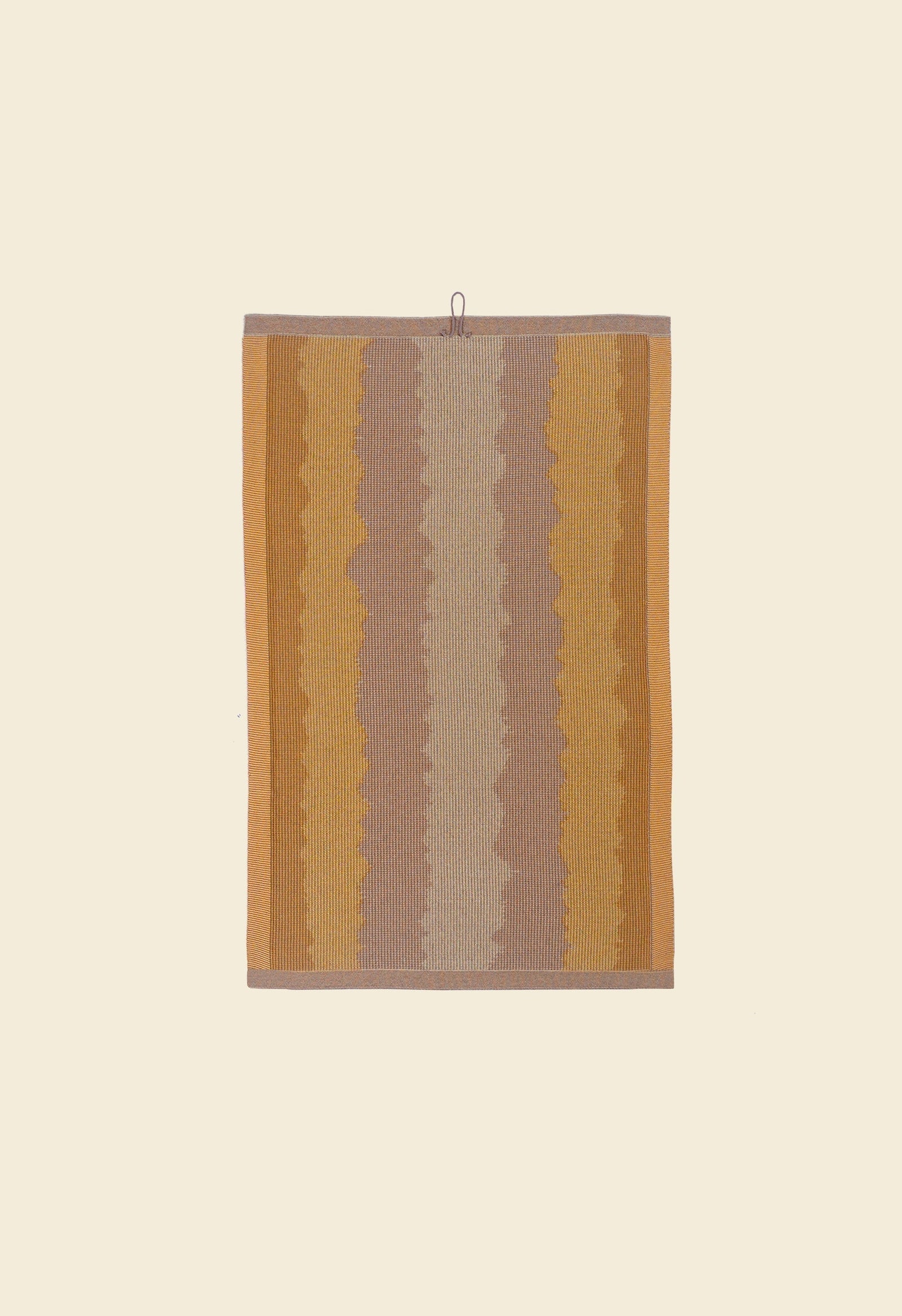 back side of yellow knit organic cotton kitchen towel with wavy pattern