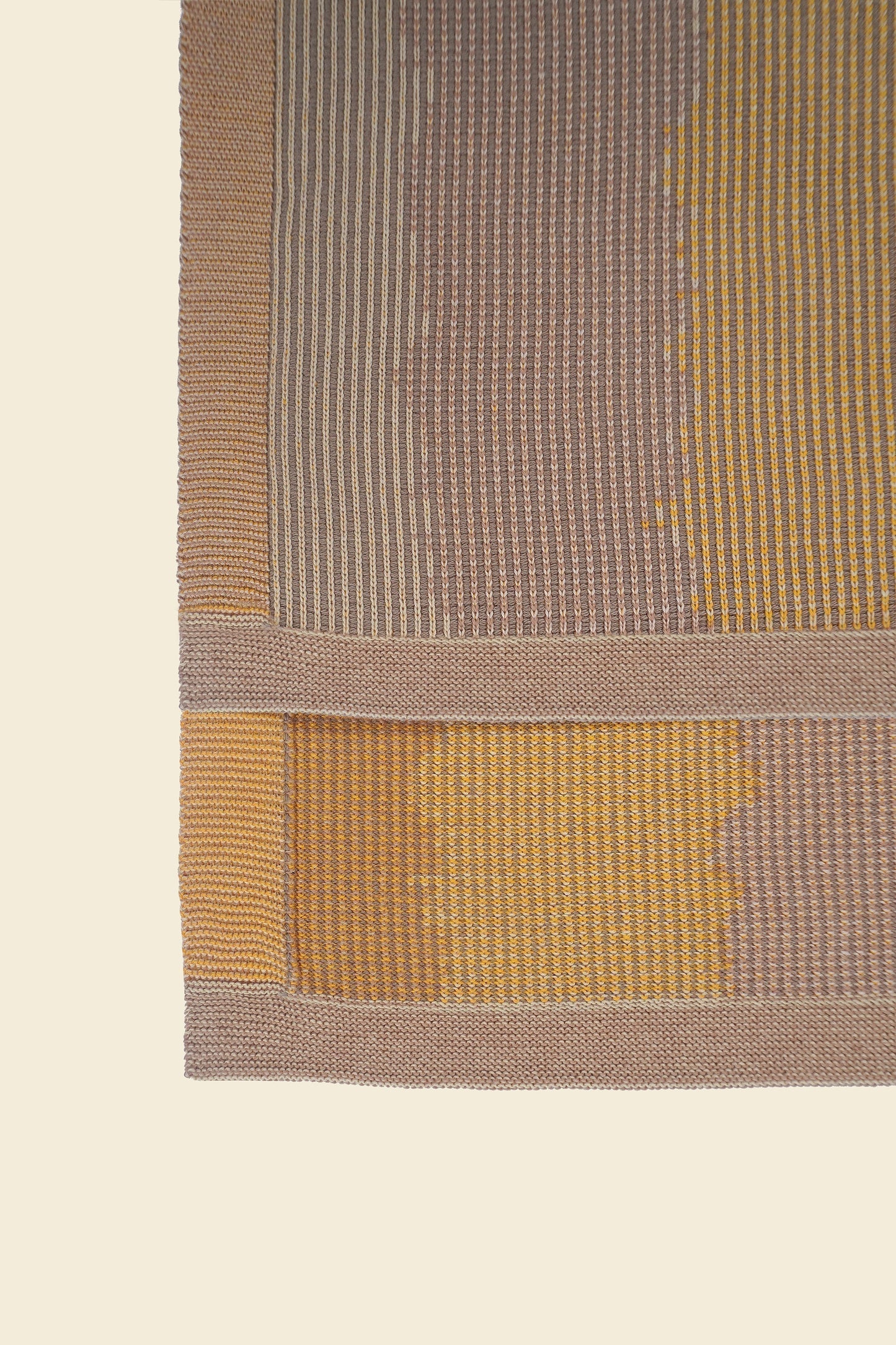 corner detail of yellow knit organic cotton kitchen towel with wavy pattern
