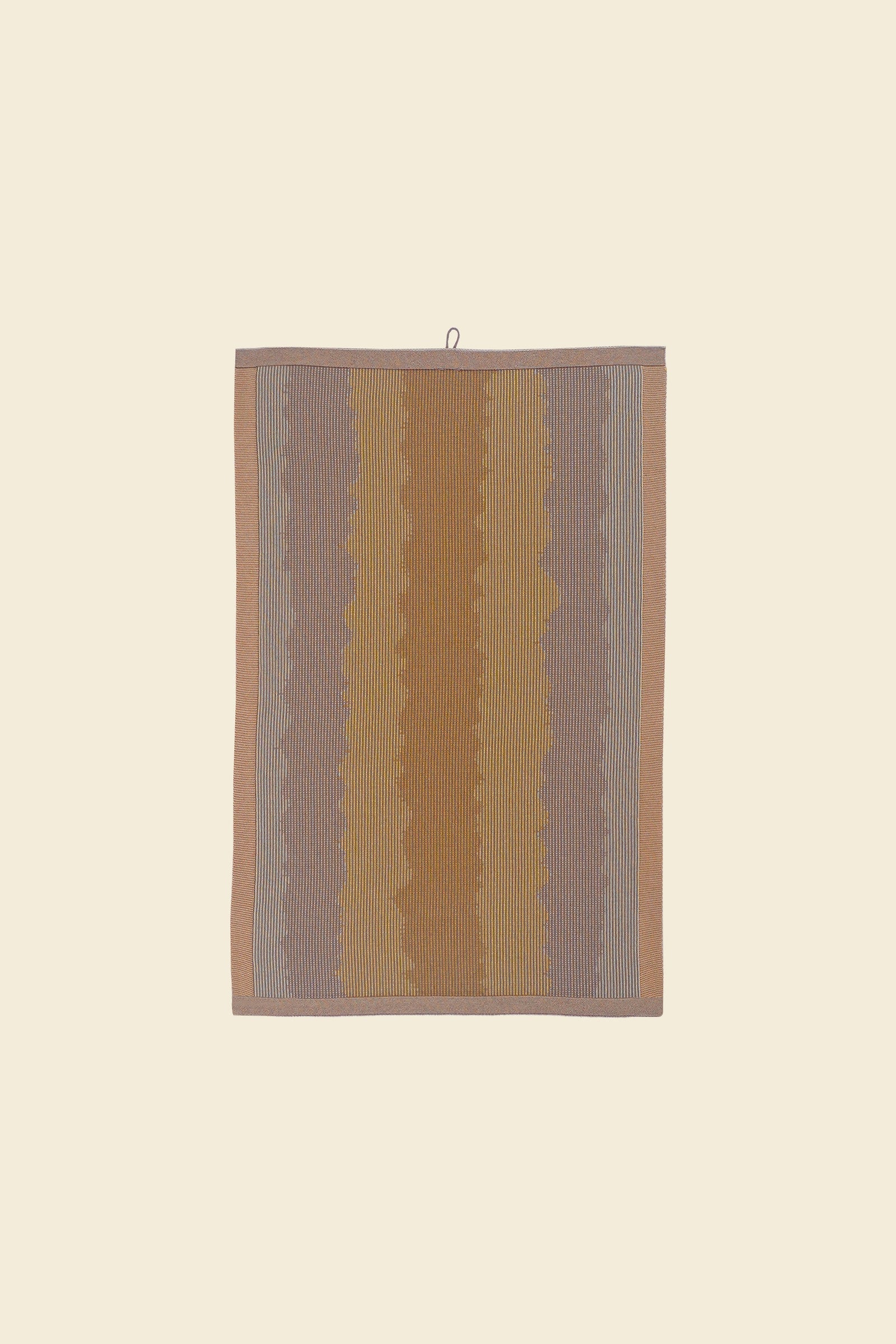 front of yellow knit organic cotton kitchen towel with wavy pattern