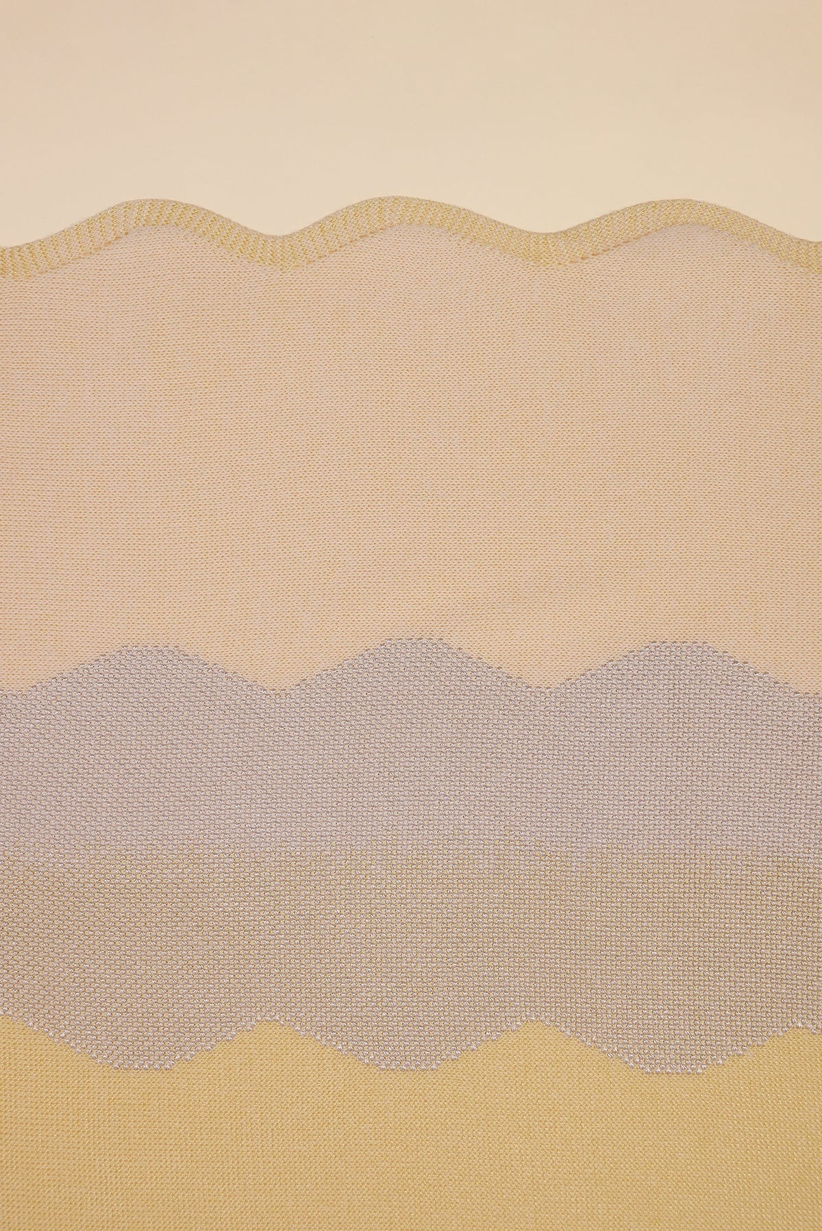 detail of wavy knit organic cotton table runner in yellow