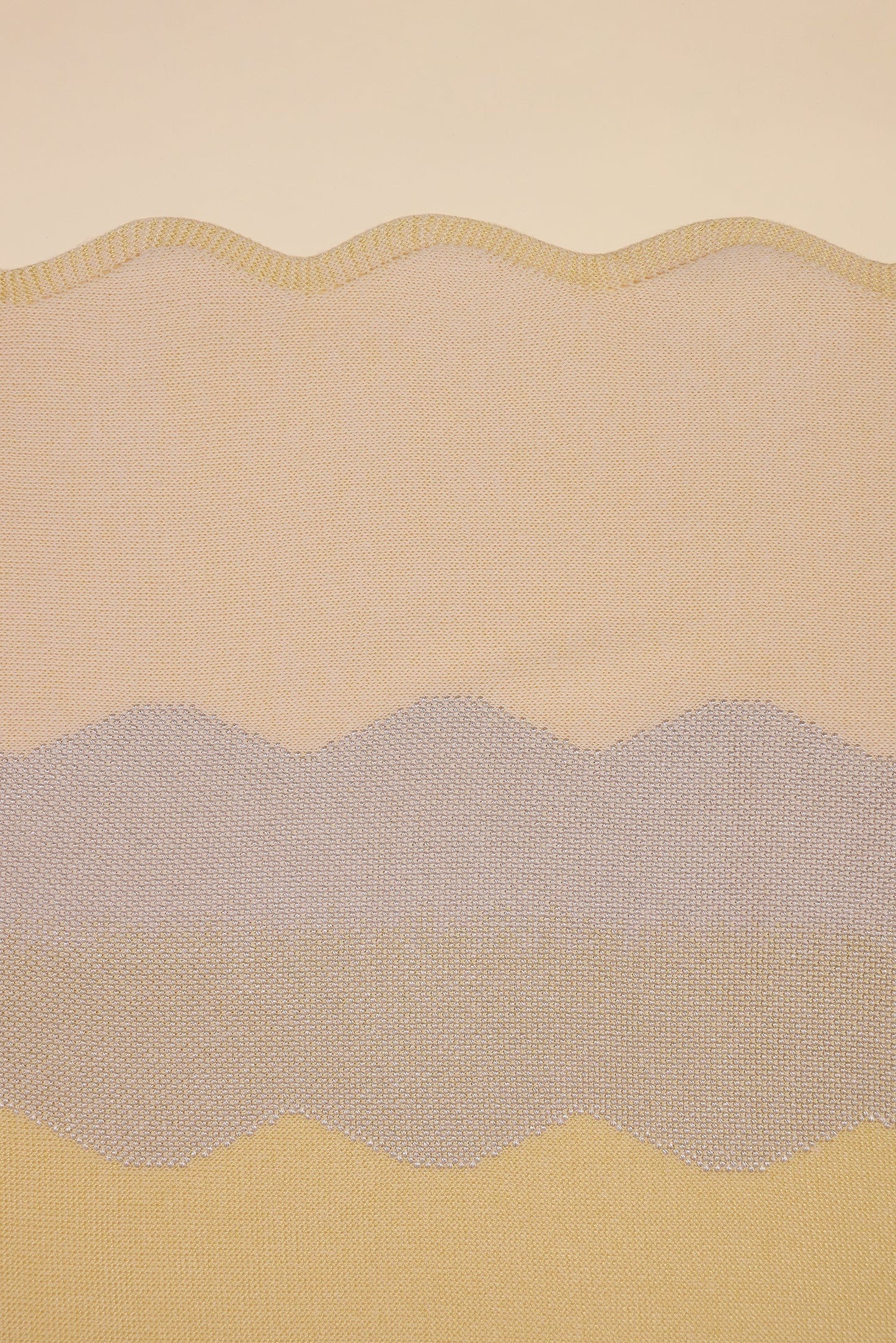 detail of wavy knit organic cotton table runner in yellow