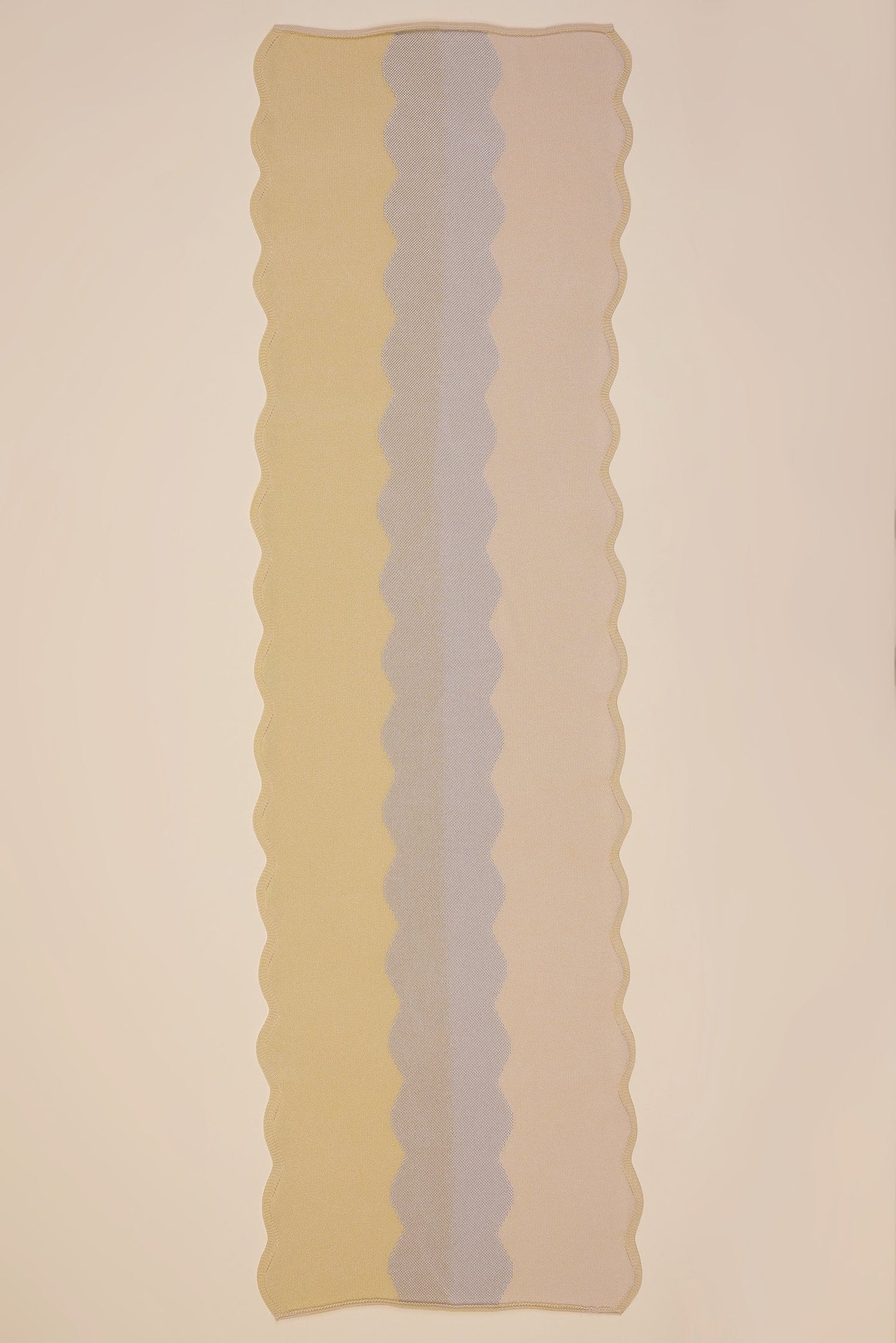 top view of wavy knit organic cotton table runner in yellow