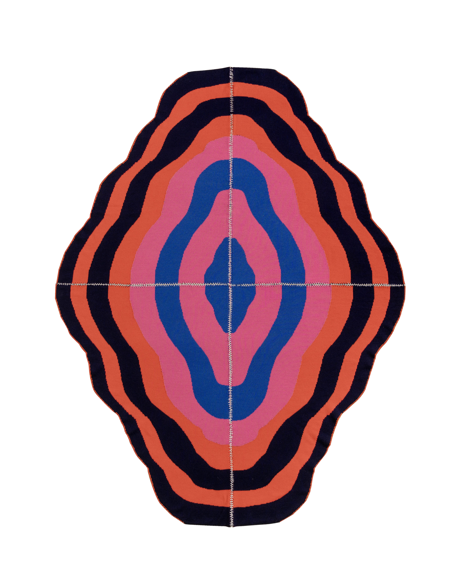 dark wavy knit wool blanket with hand-stitched seam in blue, pink, red and navy 