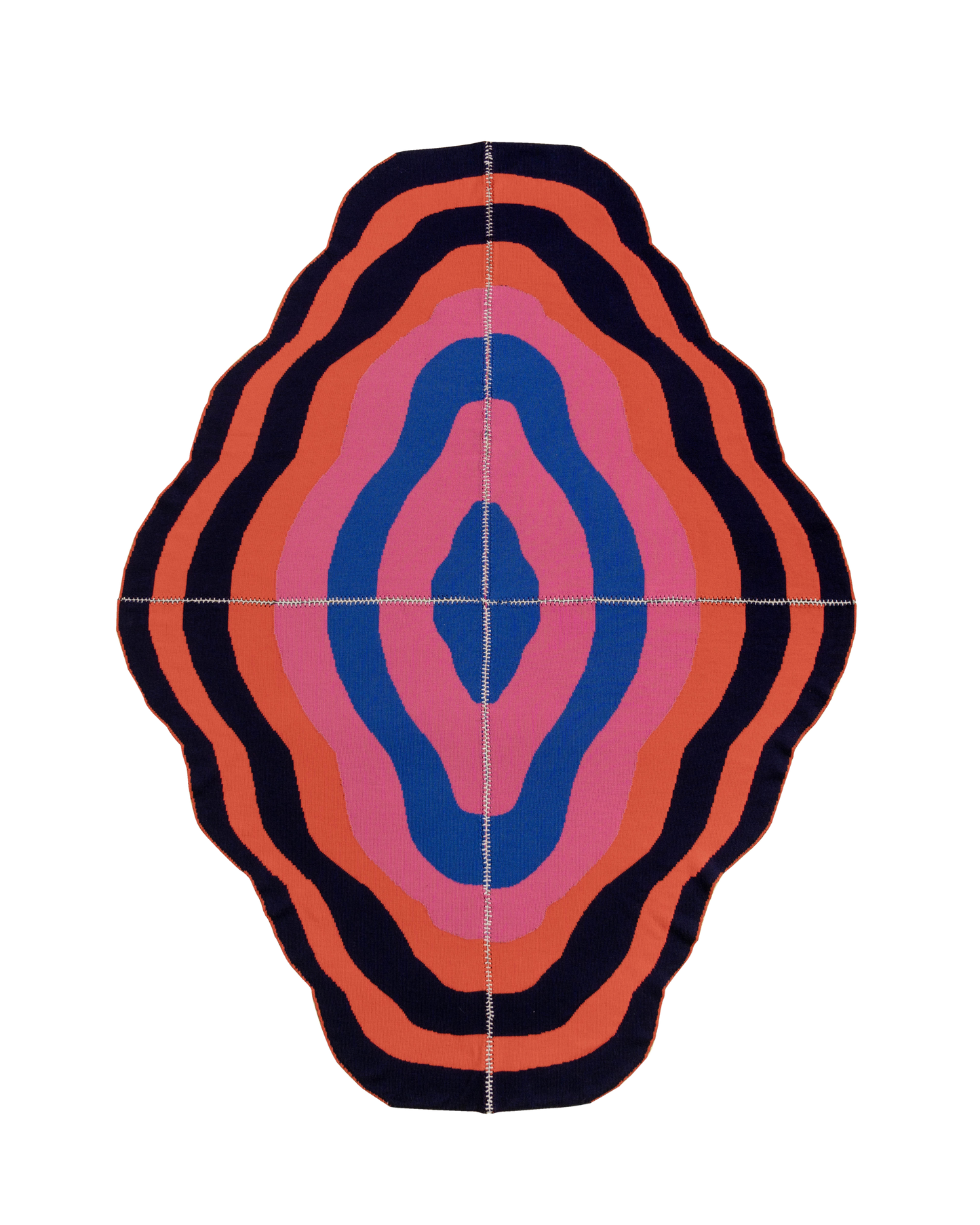 dark wavy knit wool blanket with hand-stitched seam in blue, pink, red and navy 