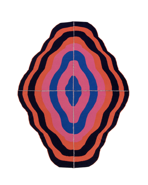 dark wavy knit wool blanket with hand-stitched seam in blue, pink, red and navy 