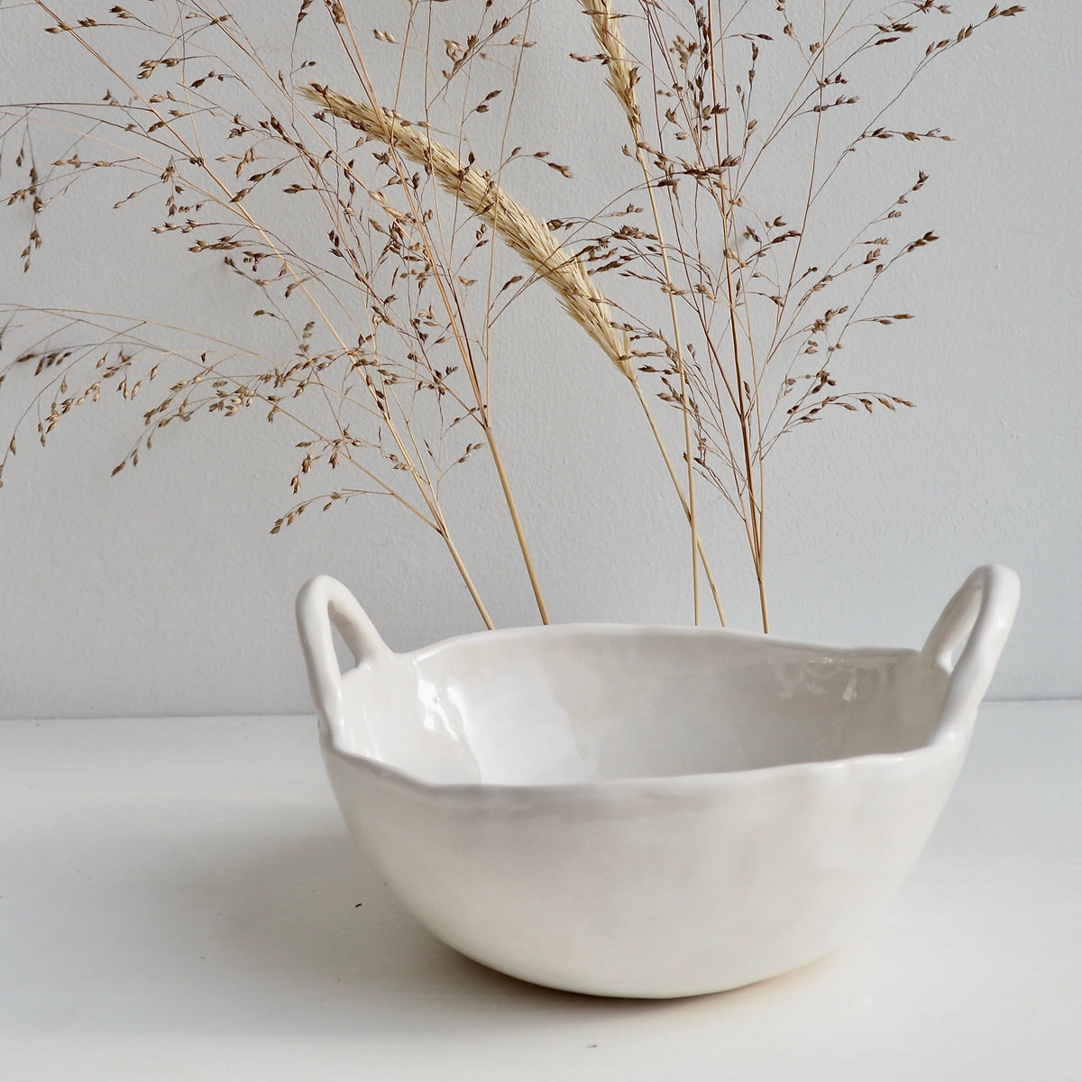  white ceramic bowl with handles