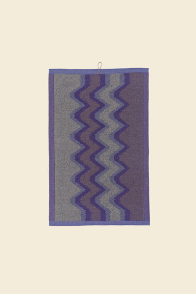 back side of purple knit organic cotton kitchen towel with zig zag pattern