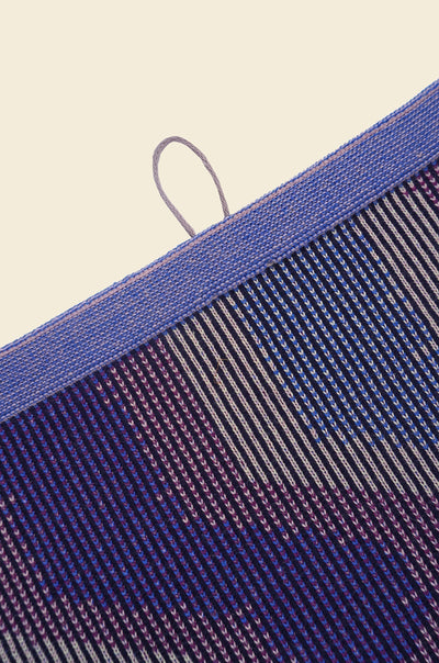 top detail of purple knit organic cotton kitchen towel with zig zag pattern