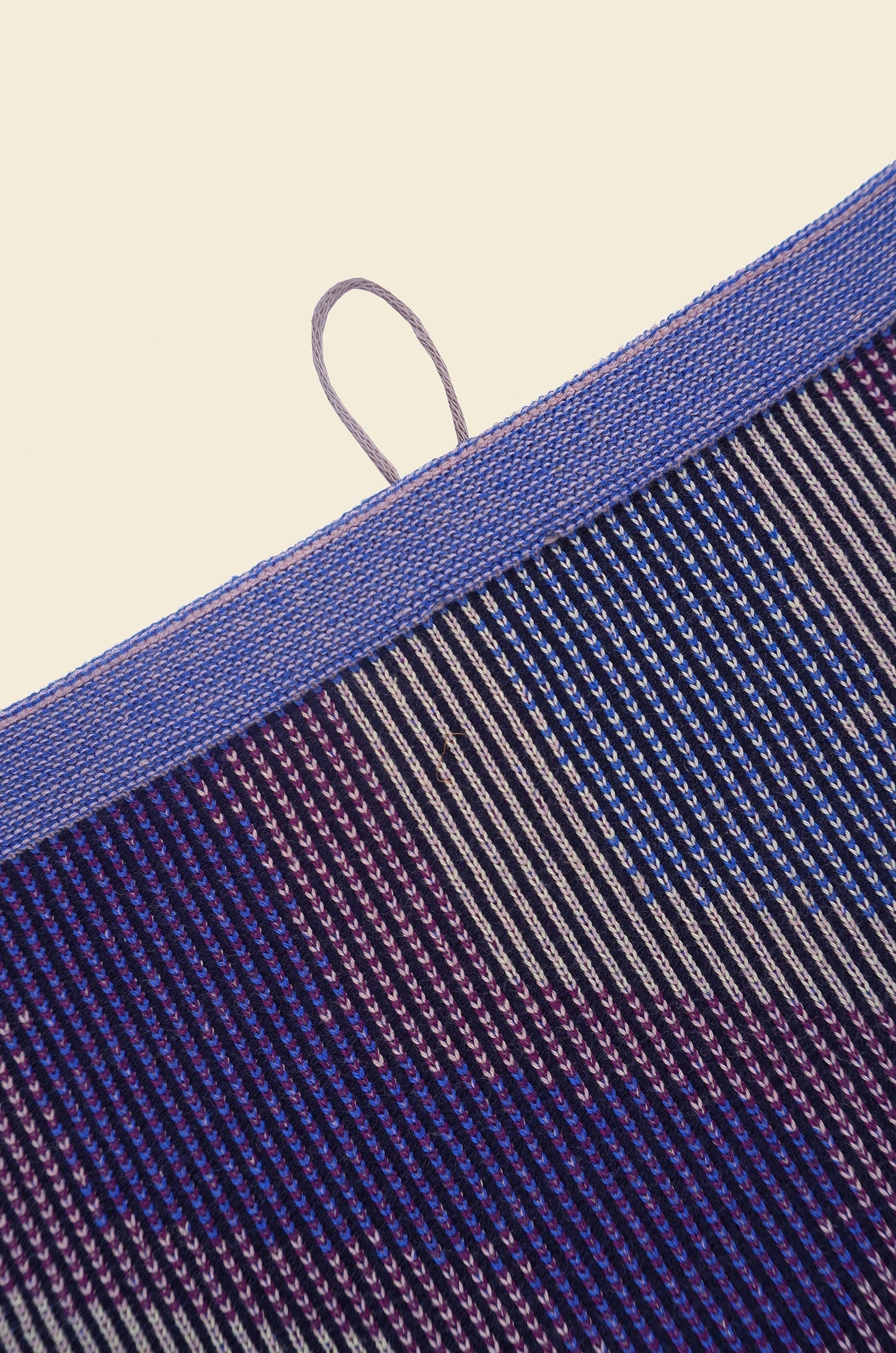 top detail of purple knit organic cotton kitchen towel with zig zag pattern