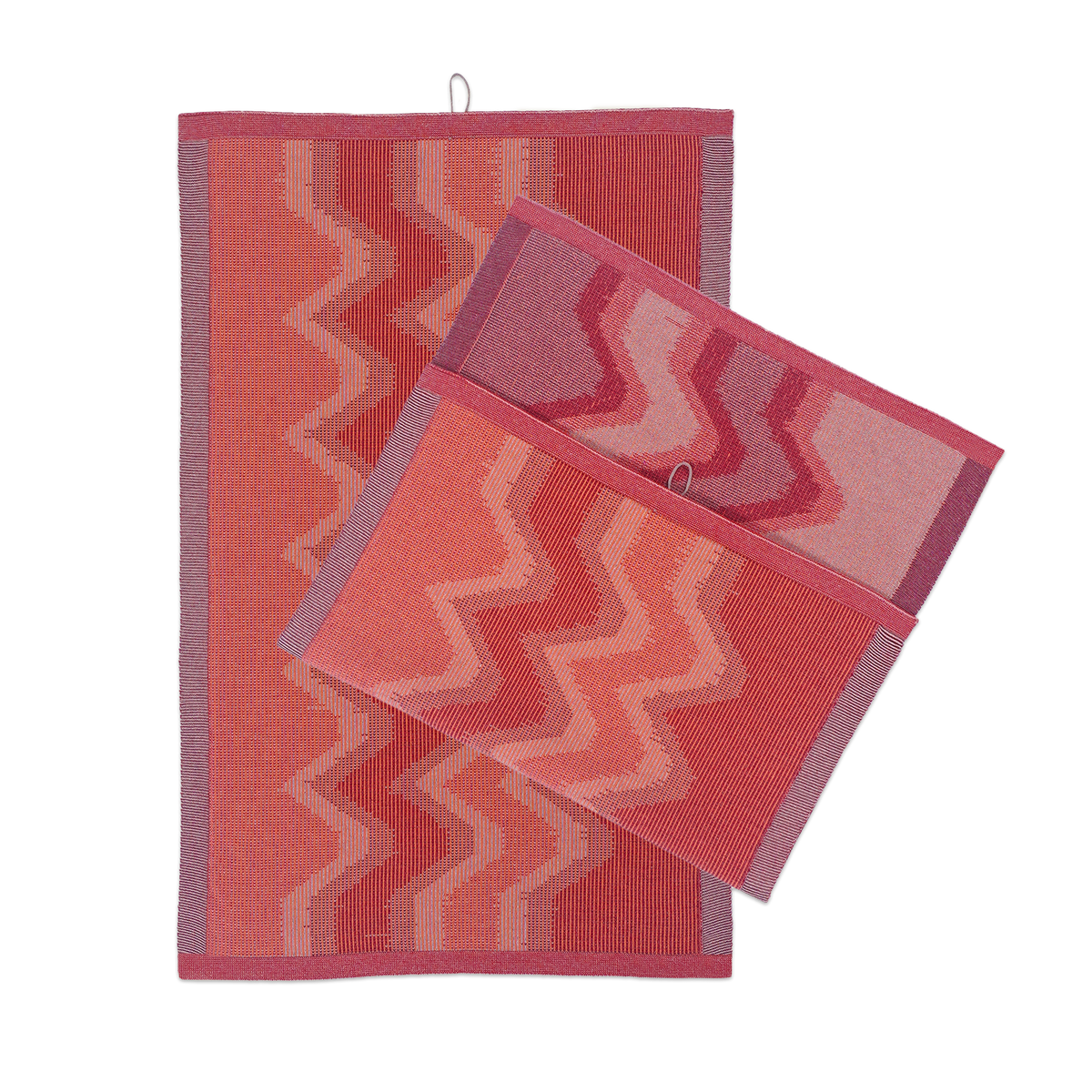 front view of red knit organic cotton kitchen towel set with zig zag pattern