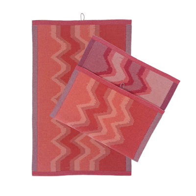 front view of red knit organic cotton kitchen towel set with zig zag pattern