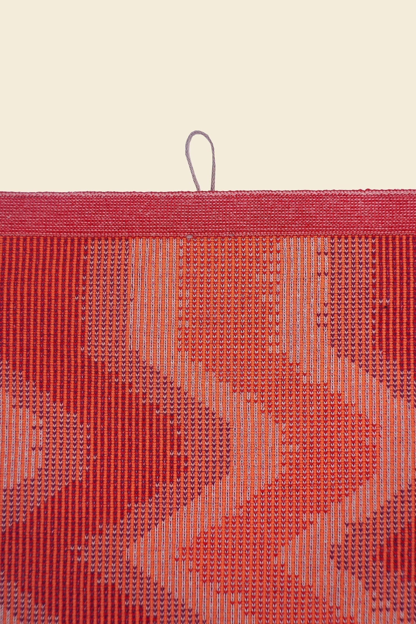 top detail of red knit organic cotton kitchen towel with zig zag pattern