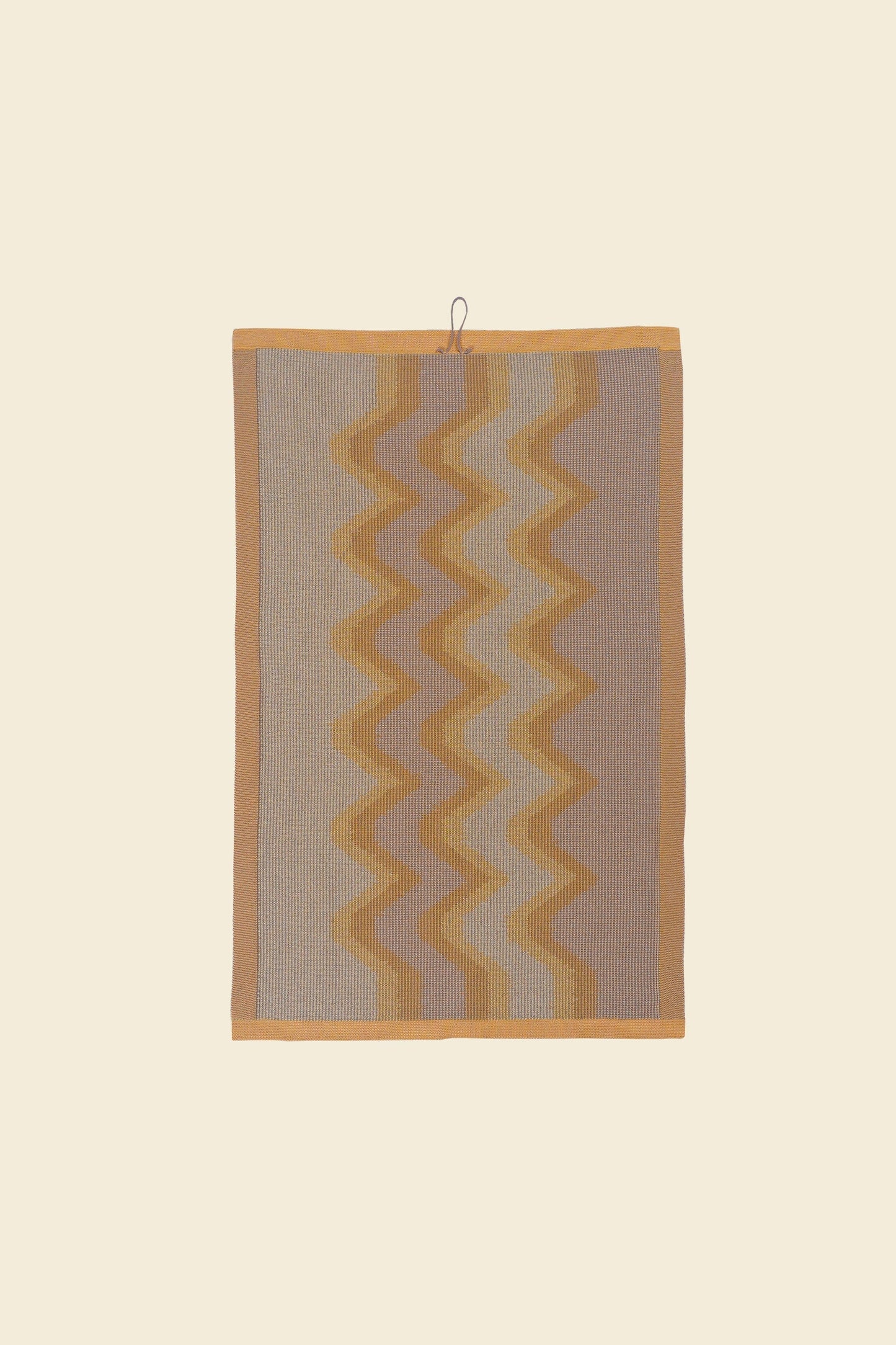 back side of yellow knit organic cotton kitchen towel with zig zag pattern