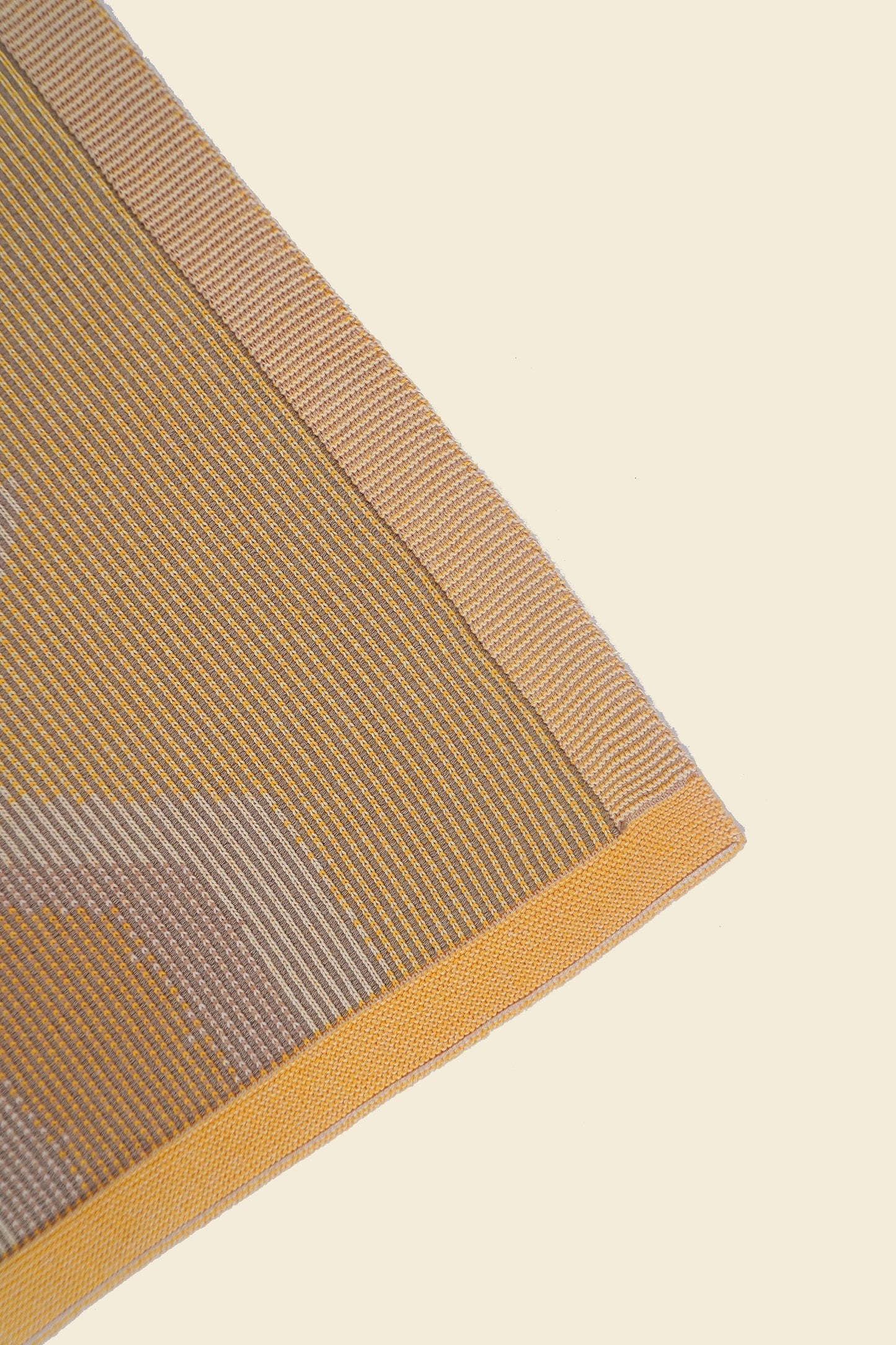 corner of yellow knit organic cotton kitchen towel with zig zag pattern