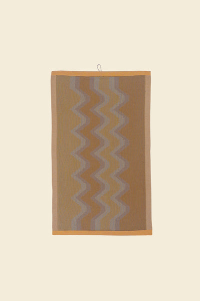 front view of yellow knit organic cotton kitchen towel with zig zag pattern