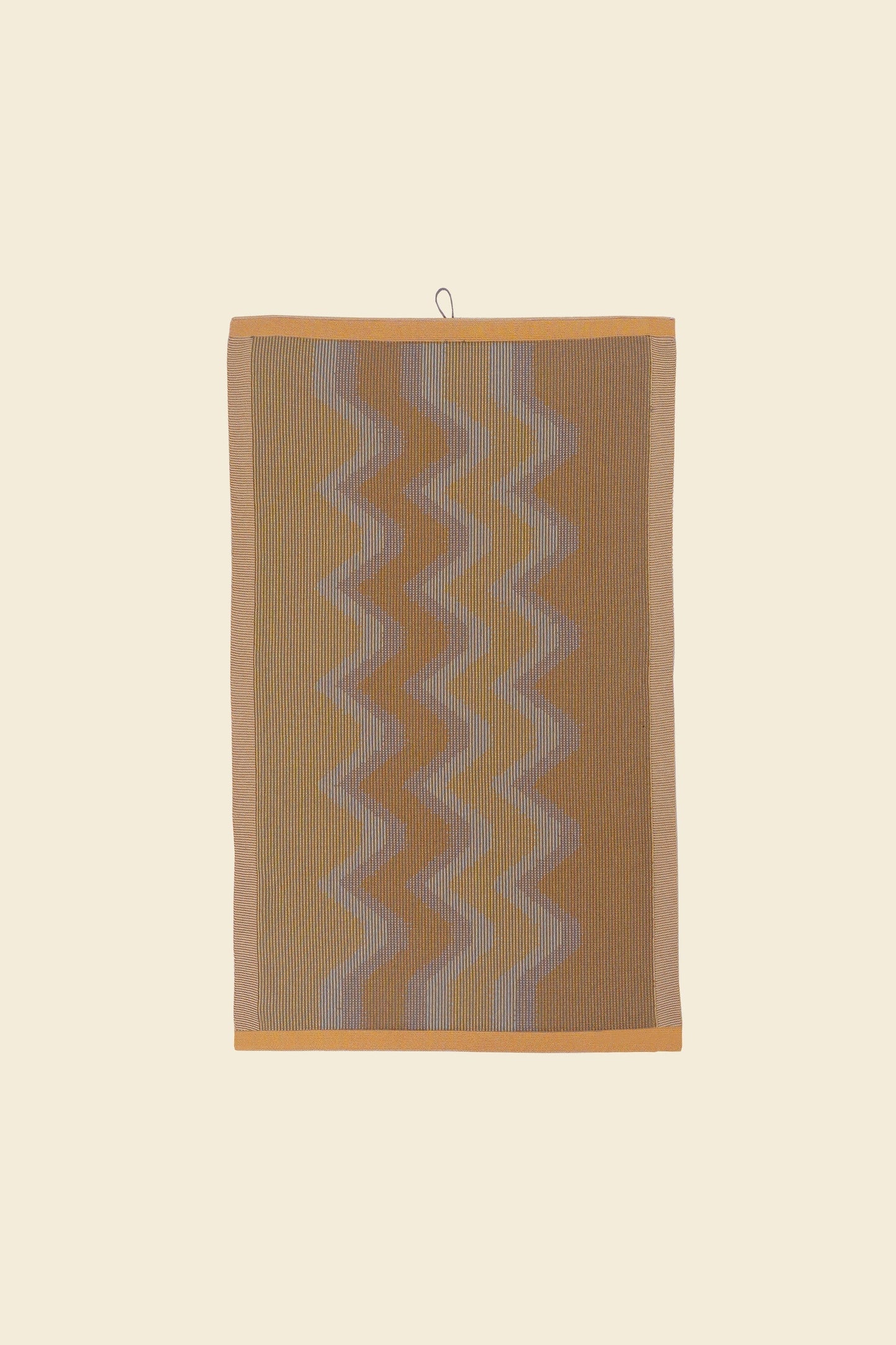 front view of yellow knit organic cotton kitchen towel with zig zag pattern