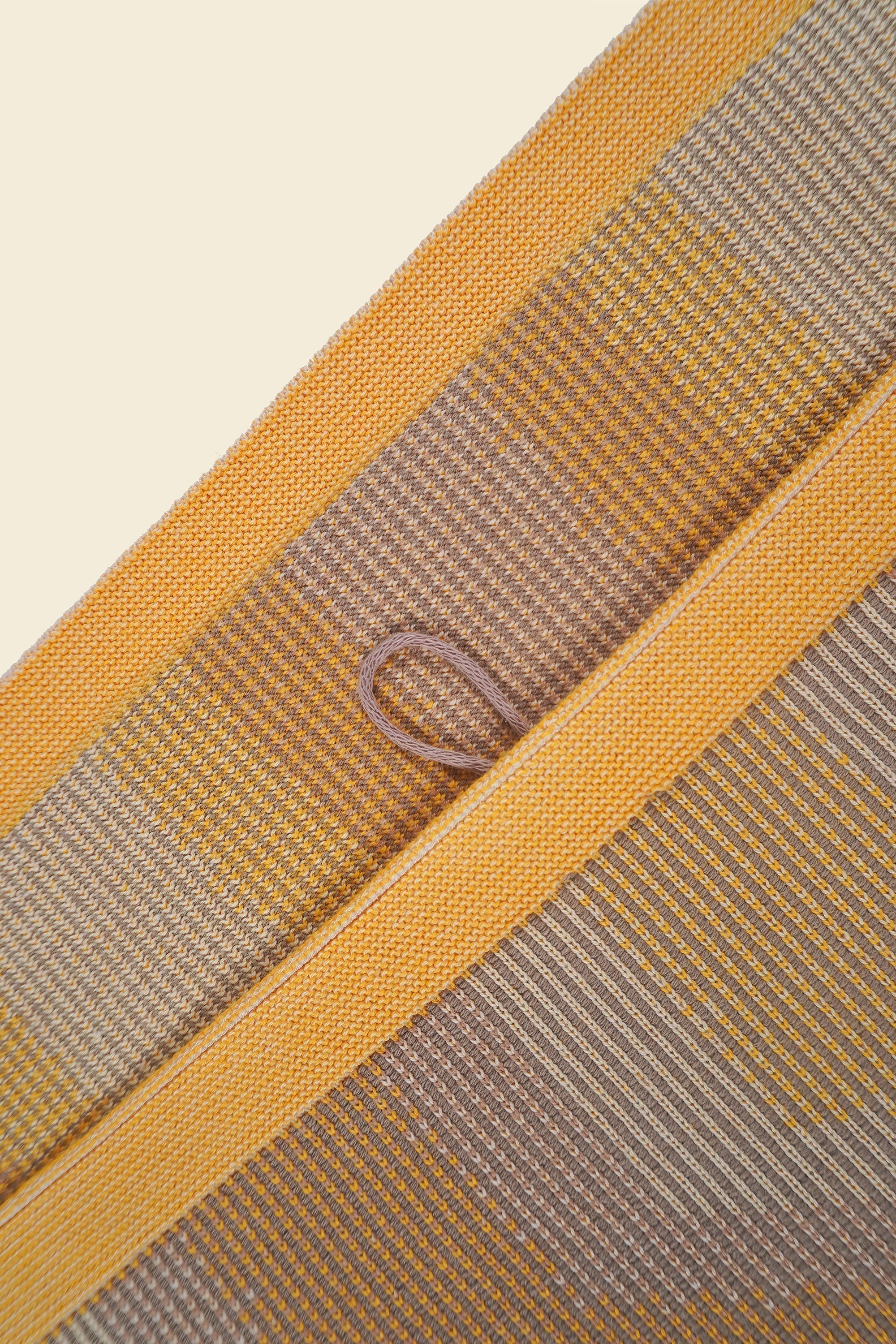 top detail of yellow knit organic cotton kitchen towel set with zig zag pattern