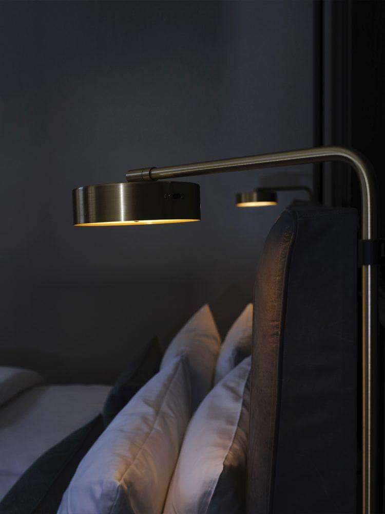 James Floor Lamp beside bed