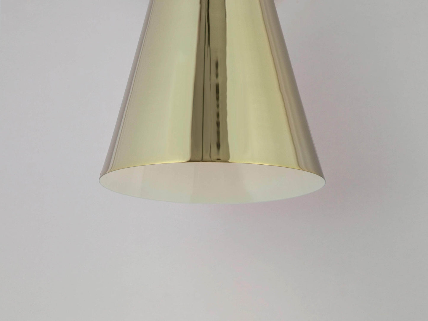 Brass cone shade wall light