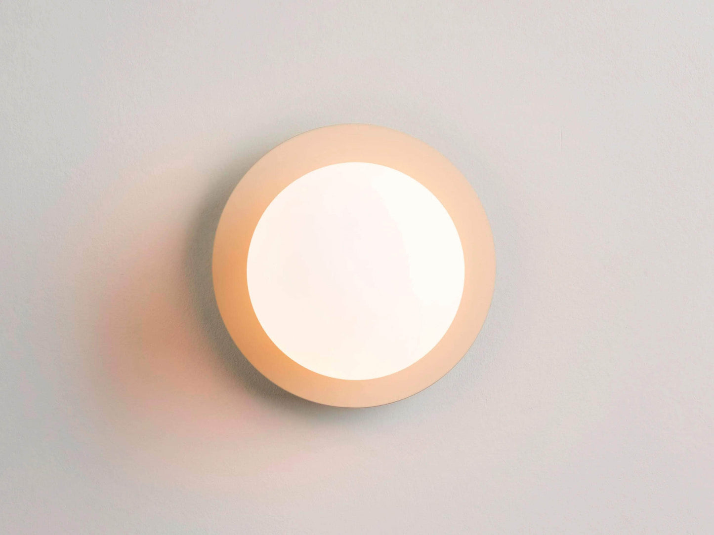 Sand opal disk wall light