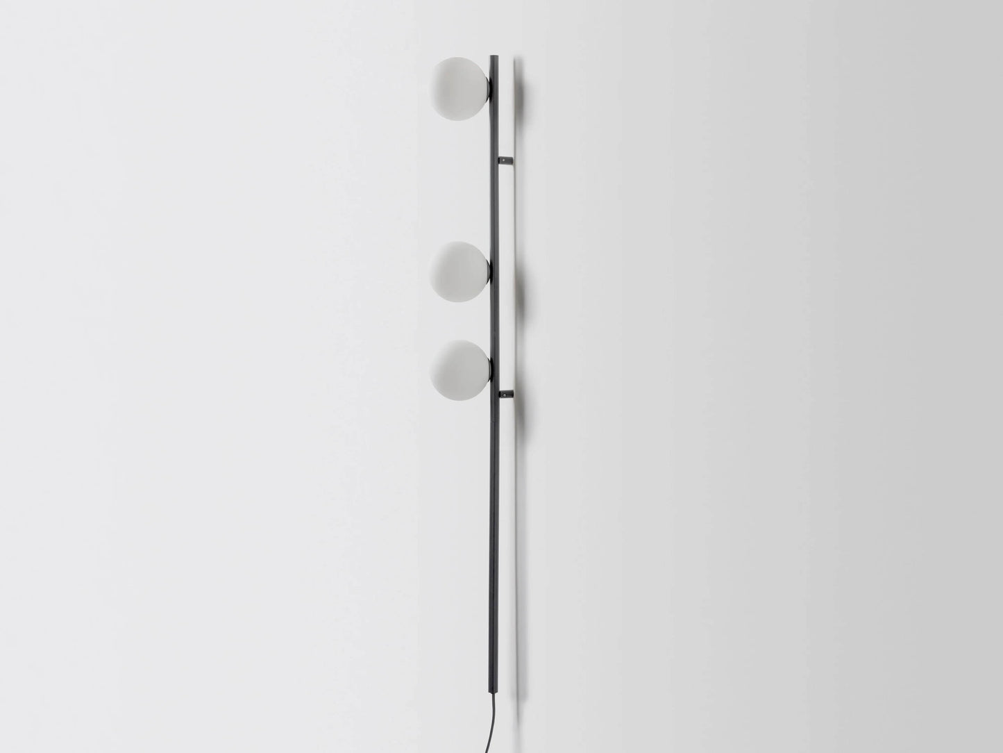 Charcoal grey bar opal ball wall light