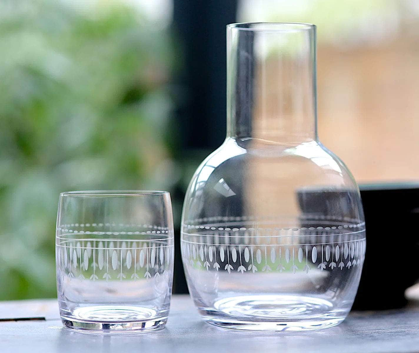 A Crystal Carafe Set with Ovals Design