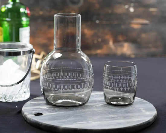 A smoky crystal carafe set with ovals design