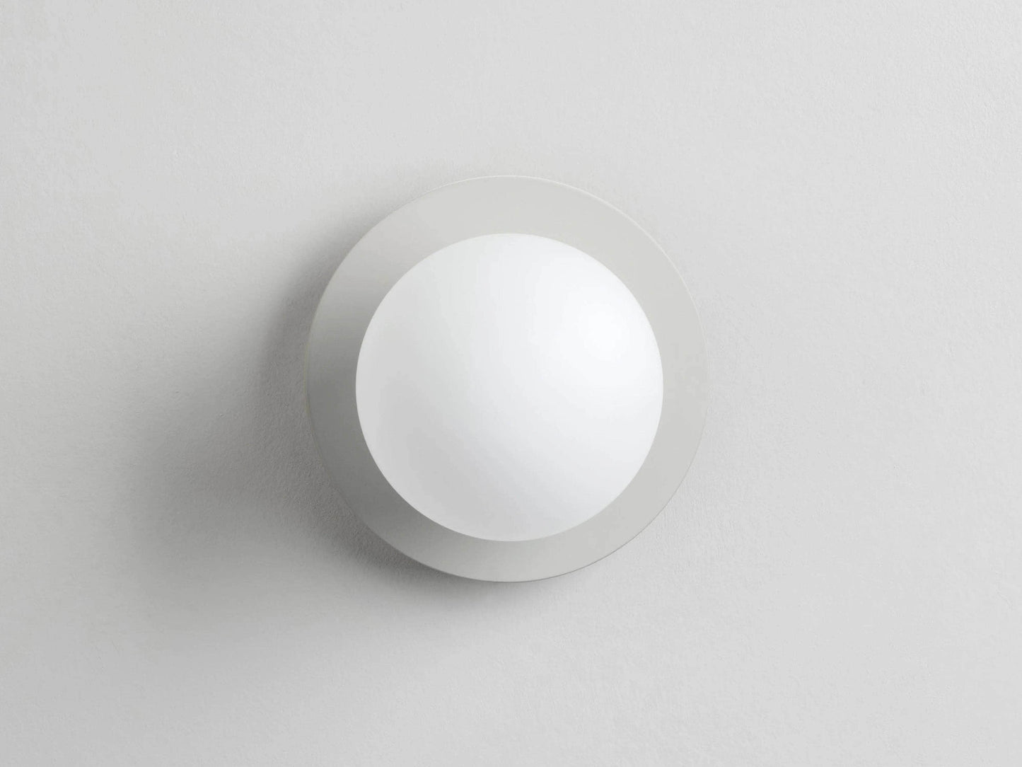 Sand opal disk wall light