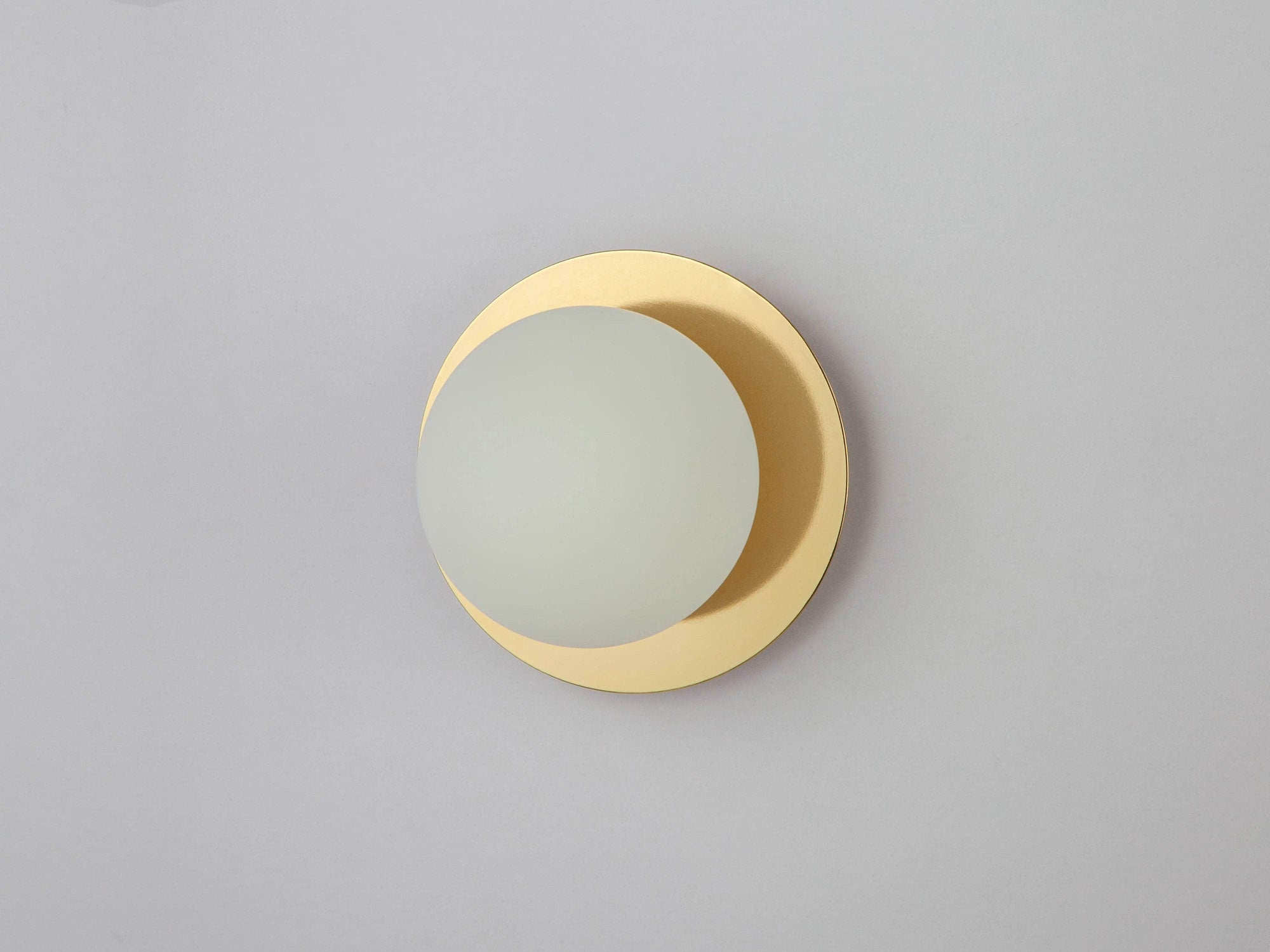 Brass opal disc wall light