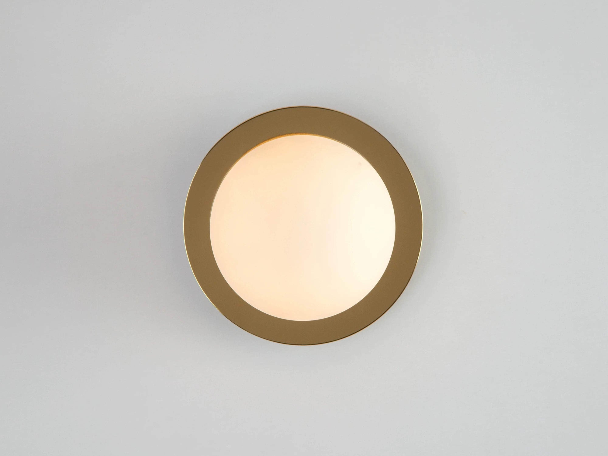 Brass opal disc wall light