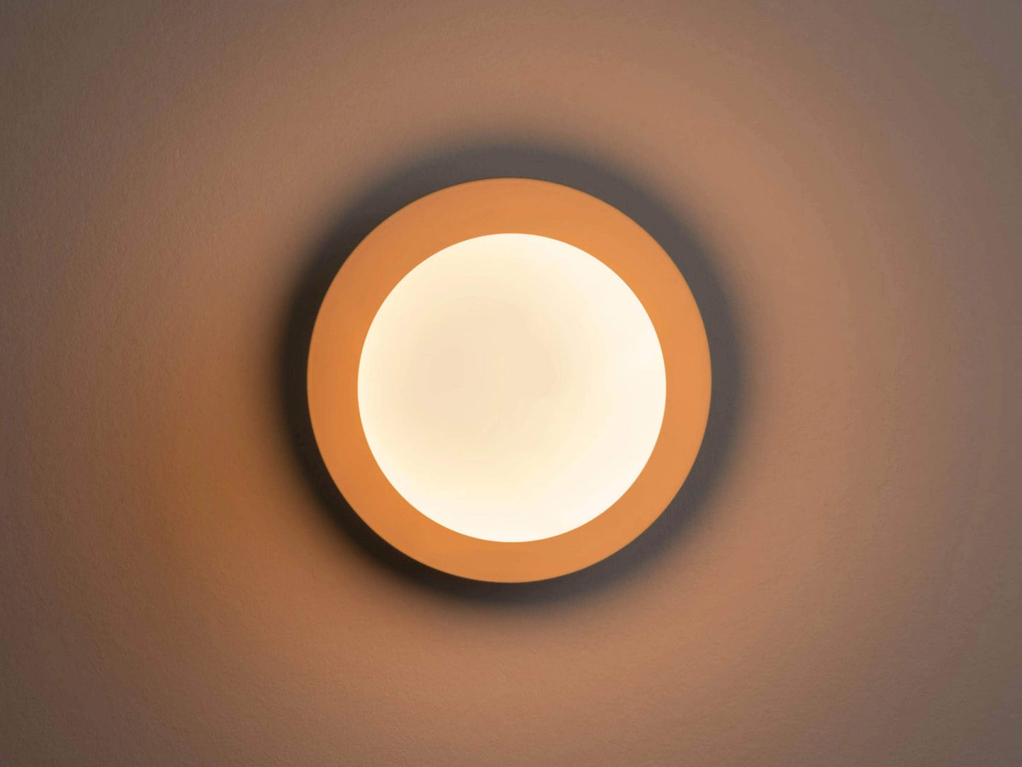 Sand opal disk wall light