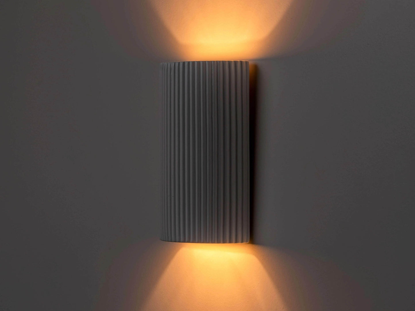 White ribbed ceramic pillar wall light