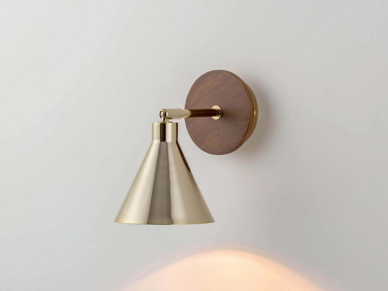 Brass cone wall light
