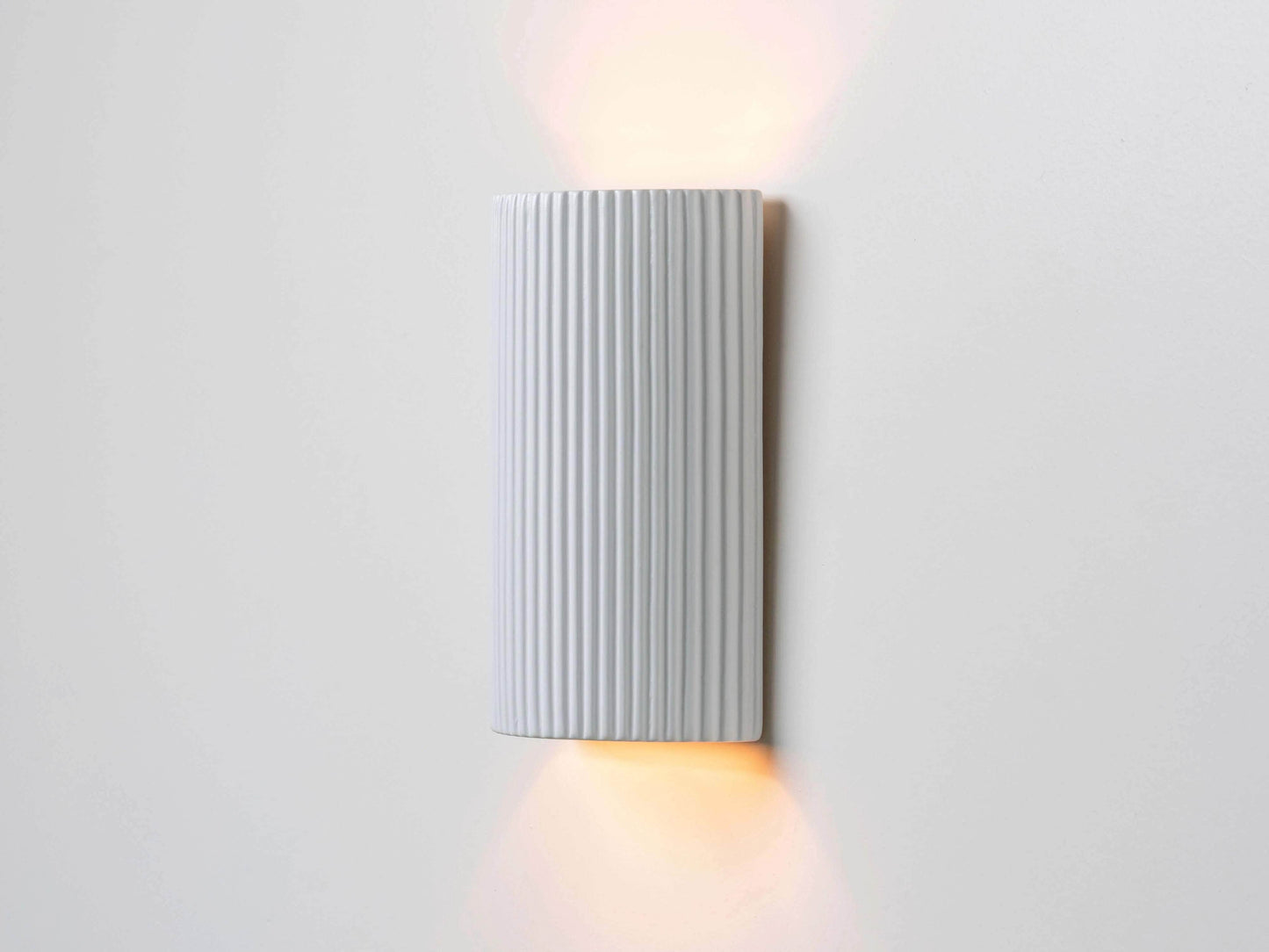 White ribbed ceramic pillar wall light